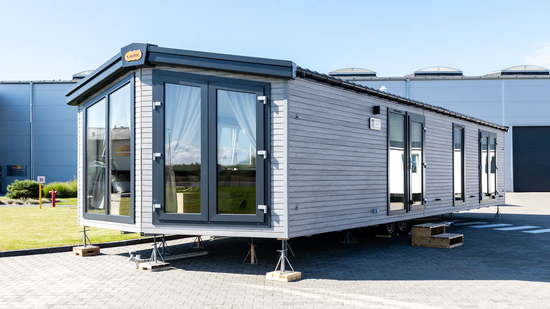 PAG mobile home with large windows in the front part of the house